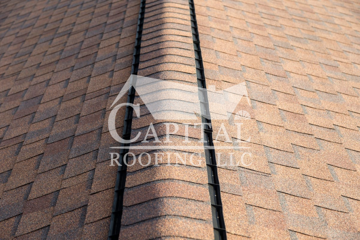 Roof ridge covered with  ridge cap shingles